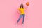 Full body photo of brunette hair young lady play baskerball wear jeans t-shirt isolated on pink color background