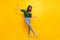 Full body photo of careless pretty joyful young woman raise hands dancer wear glasses isolated on yellow color