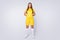 Full body photo of cool lady skilled player soccer team hold hands behind back wear yellow football uniform yellow t