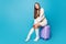 Full body photo of dreamy flirt charming girl ready for honeymoon vacation weekend sitting on suitcase send air kiss