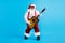 Full body photo of fat funky santa claus with bif abdomen beard play guitar on x-mas christmas tradition party wear