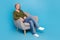 Full body photo of good mood pensioner grey hair woman sitting comfort furniture interview her candidates isolated on