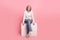 Full body photo of gorgeous mature grandma relax sit cube shopping banner wear trendy white outfit isolated on pink