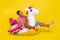 Full body photo of guy swim unicorn lifebuoy ocean wear red striped clothes isolated over bright yellow color background