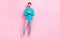 Full body photo of handsome young guy holding telephone email user subscribe wear trendy blue clothes isolated on pink