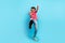 Full body photo of handsome young male dancer earphones thumb up down dressed stylish pink outfit isolated on blue color