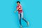 Full body photo of handsome young male dancer yellow earphones excited wear trendy pink outfit isolated on blue color
