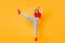 Full body photo lady having fun raise leg youth dance party chill wear red crop top jeans isolated yellow color