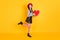 Full body photo of nice cute sweet young woman hold red heart figure good mood smile isolated on yellow color background