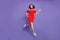 Full body photo of pretty jumping high lady rushing sale wear red dress isolated purple background