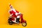Full body photo of santa grandpa riding x-mas party by bike shocking moped speed wear stylish sun specs red coat
