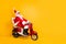 Full body photo of santa white hair grandpa riding speed x-mas party by bike afraid to be late wear trendy sun specs red