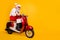 Full body photo of santa white hair grandpa rushing newyear party by bike dislike cold temperature wear trendy sun specs