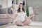 Full body photo of young attractive pregnant woman happy positive smile sit floor meditate yoga calm rest relax home