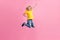 Full body photo of young boy happy positive smile jump up fly superhero power isolated over pink color background