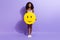 Full body photo of young cheerful african woman happy positive hold paper pinata emoji smile isolated over purple color