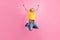 Full body photo of young cheerful school boy happy positive smile jump rejoice victory isolated over pink color