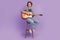 Full body photo of young guy happy positive smile good mood play guitar performance  over violet color