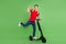 Full body photo of young guy happy smile drive electric scooter rejoice success isolated over green color background