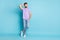 Full body photo of young handsome man confident dream dreamy look empty space isolated over blue color background