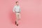 Full body photo of young man hold hands pockets confident formalwear look empty space isolated on pink color background