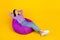 Full body photo of young satisfied korean girl hands head take nap no stress just chill soft bean bag isolated on yellow