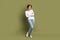 Full body portrait of charming girl model standing with crossed arms confident person isolated khaki green color