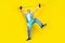 Full body portrait of excited sporty aged man have fun raise hold barbell up isolated on yellow color background