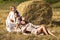 Full body portrait four young beautiful models in a beige dress