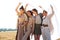 Full body portrait four young beautiful models in a beige dress