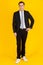 Full body portrait photo of handsome and executive look caucasian businessman in black suit pose in boss action and positive smile