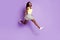 Full body profile photo of attractive dark skin person running empty space  on violet color background