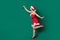 Full body profile photo of charming lady decorating newyear fir evergreen pine tree hanging high toy bauble holly jolly