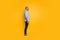 Full body profile side photo of concentrated millennial listen look isolated over yellow background