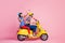 Full body profile side photo of positive amours two people travel trip on speedy yellow chopper woman sit shoot arrow in