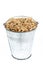 Full bucket of oats grains on a white background