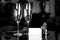 Full champagne glasses, antique keys and blank white card. Luxury hotel apartment