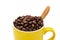 Full coffee beans in yellow cup