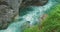 Full-flowing mountain stream in rocky Dark gorge, Austria. Spring clear water in ravine. Shooting during heavy rain.