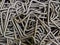 full frame abstract industrial background of bent steel rods