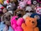 A full frame of childrenâ€™s toys, a bunch of old torn or worn teddy bears from childhood