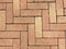 Full frame close up of red pavement bricks on symmetrical order as backbground