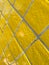 Full frame detail of yellow tiled wall
