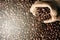 Full frame image of fresh dark roasted coffee beans with gunny burlap sack