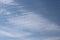 Full frame of pretty blue sky with soft scudding cloud formation