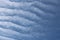 Full frame of pretty blue sky with unusual scudding cloud formation