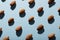 Full frame shot of almonds arranged side by side on blue background