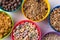 Full frame shot of different breakfast cereals in bowls arranged on table with copy space