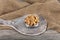 Full frame top view of large amount of raw delicious cashews placed on smooth surface. Pile of shelled cashew nuts in copper bowl