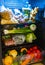 Full fridge with everything you need fruit vegetables drinks beer Mexico